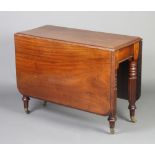 A 19th Century mahogany drop flap gateleg dining table, raised on 6 turned and reeded supports