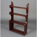 An Edwardian range of 4 hanging shelves 101cm h x 60cm w x 14cm d There is a split to the top left