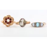 A 9ct yellow gold garnet ring size P, an opal ditto size P, a portrait ring size P 1/2