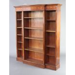 A 19th Century style inlaid mahogany breakfront bookcase with moulded cornice, fitted adjustable