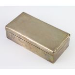 An Art Deco rectangular engine turned silver cigarette box, London 1931, 17.5cm There are minor