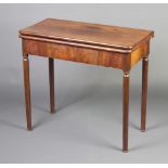 A 19th Century Continental card table fitted 1 long drawer, the back raised on turned supports