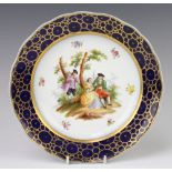 A Meissen plate decorated with a fete gallant view 24cm, a Sevres ditto decorated with a portrait of