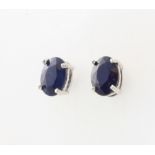 A pair of silver sapphire ear studs