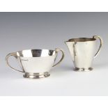 A silver cream jug and 2 handled sugar bowl Birmingham 1934, 453 grams