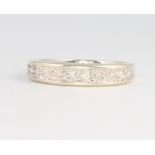 A 9ct white gold diamond set half eternity ring size M