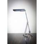 A TUBULAR CHROME ANGULAR DESK LAMP