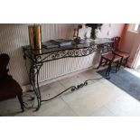 A METAL BOW FRONTED CONSOLE TABLE