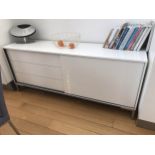 A WHITE LACQUERED SIDE CABINET, BY BO CONCEPT, with three drawers and a sliding cupboard door, 180cm