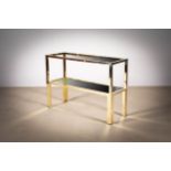 A GILT METAL TWO TIER CONSOLE TABLE, ITALIAN, with smoked mirrored glass shelves