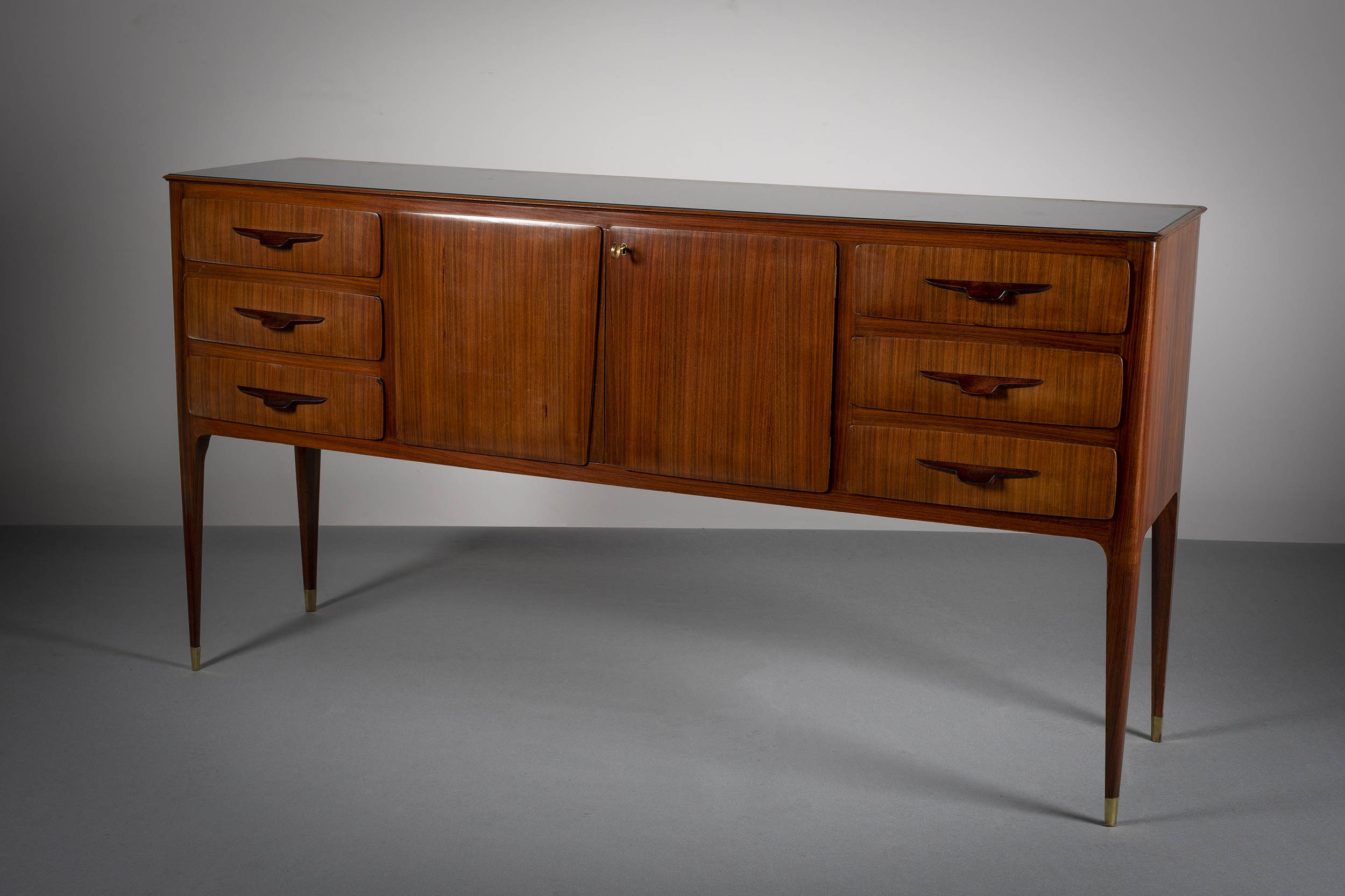 A FINE ROSEWOOD COCKTAIL CABINET, ITALIAN, c.1960, attributed to Vittorio Dassi, with a pair of