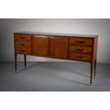 A FINE ROSEWOOD COCKTAIL CABINET, ITALIAN, c.1960, attributed to Vittorio Dassi, with a pair of