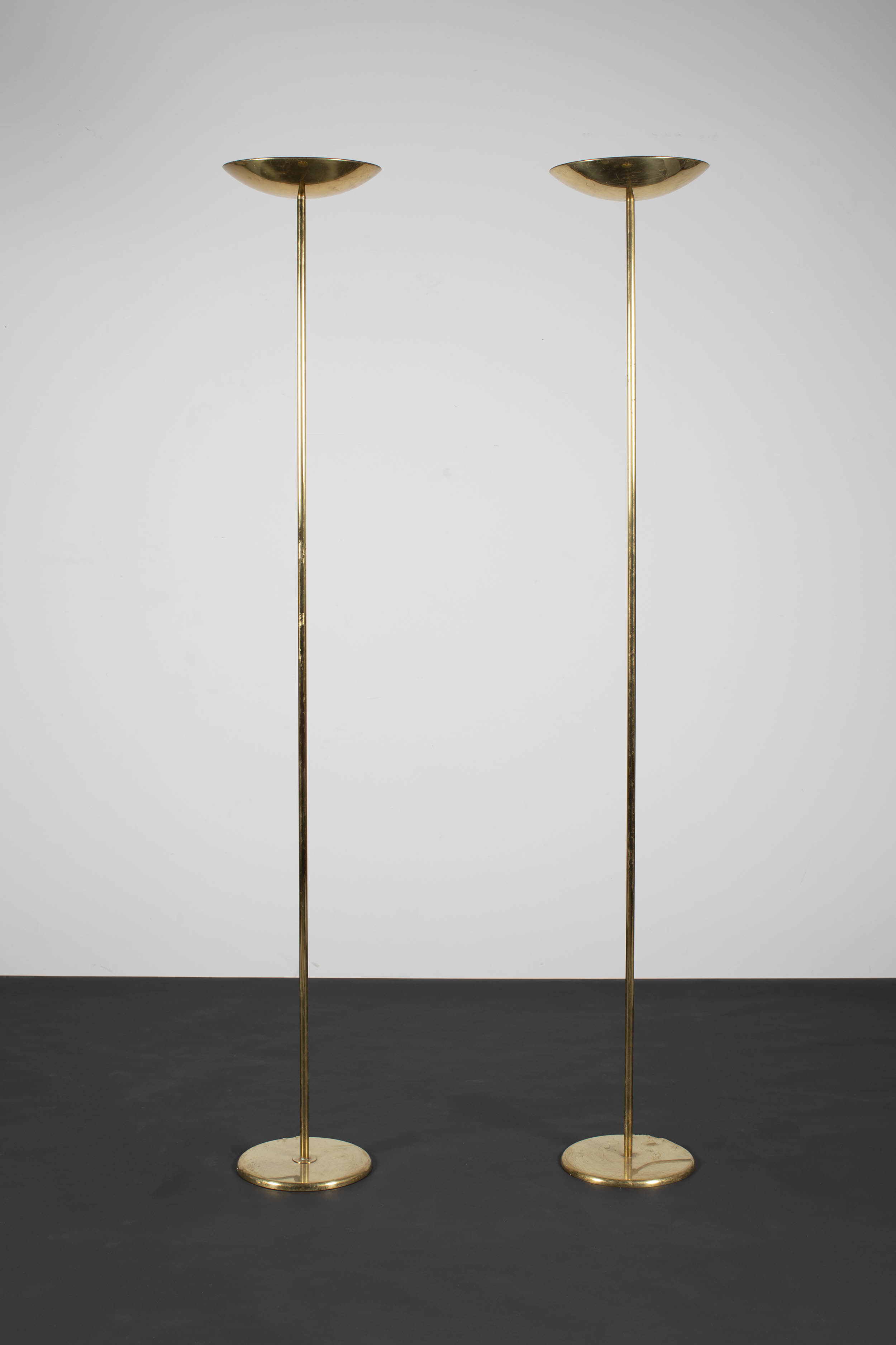 A PAIR OF GILT METAL UPLIGHTERS, ITALIAN, 1960s, on circular base, each 187cm (h)