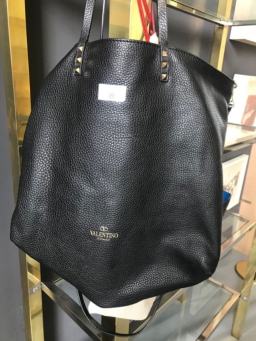 A LEATHER HANDBAG BY VALENTINO