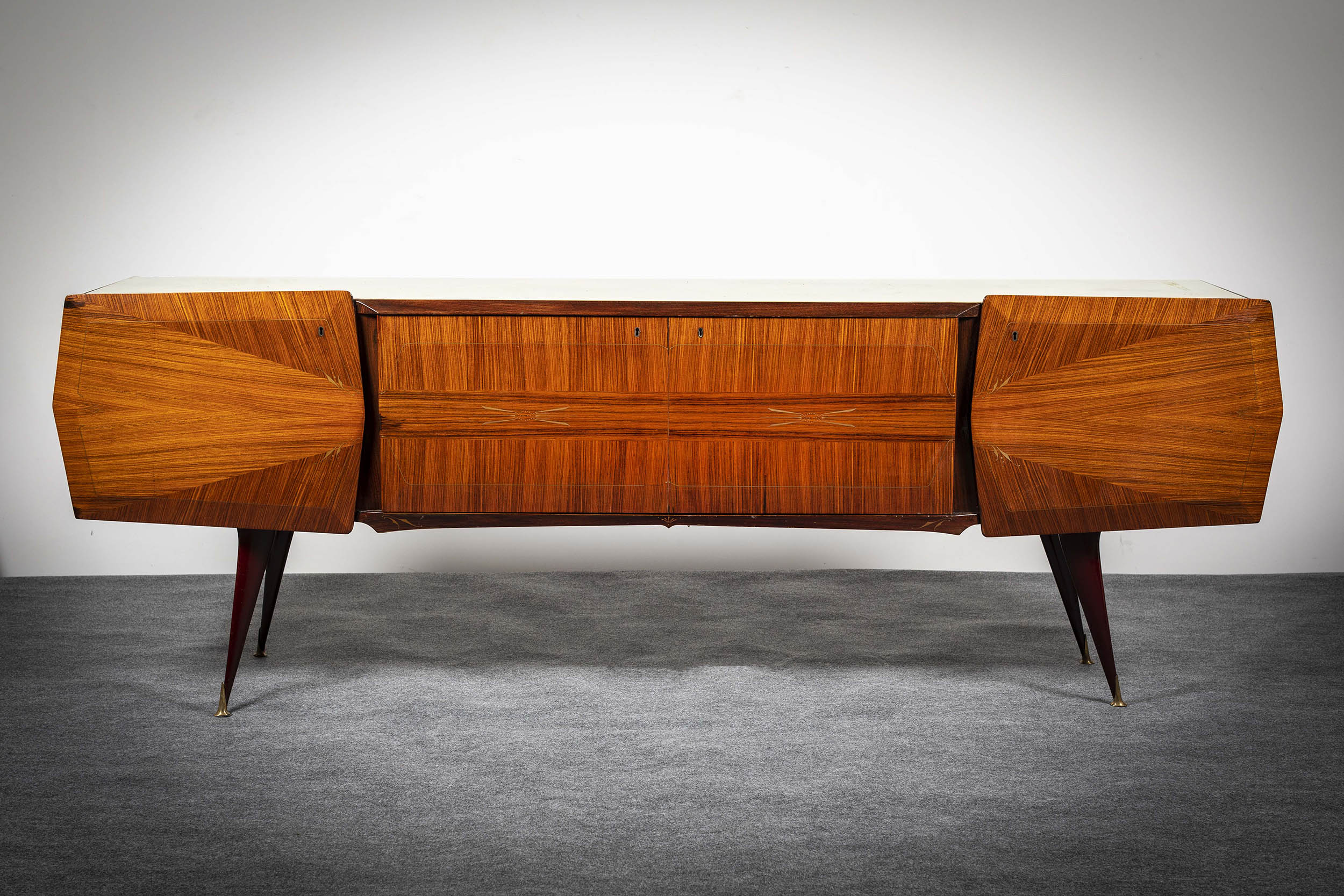 A ROSEWOOD SIDEBOARD, ITALIAN, 1950s, with milk glass top, above two cupboard door, flanked by a