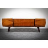 A ROSEWOOD SIDEBOARD, ITALIAN, 1950s, with milk glass top, above two cupboard door, flanked by a