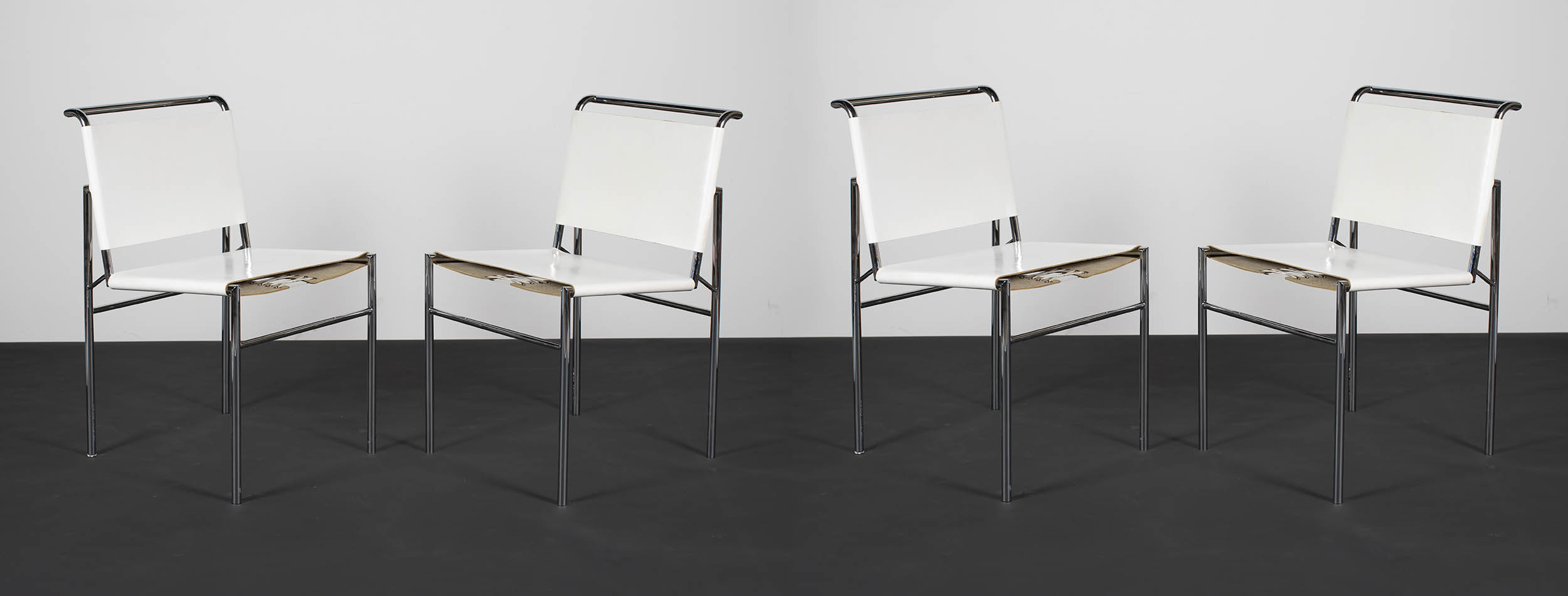 A SET OF 8 ROQUEBRUNE CHAIRS by Eileen Gray for ARAM, with chromium plated tubular frames and