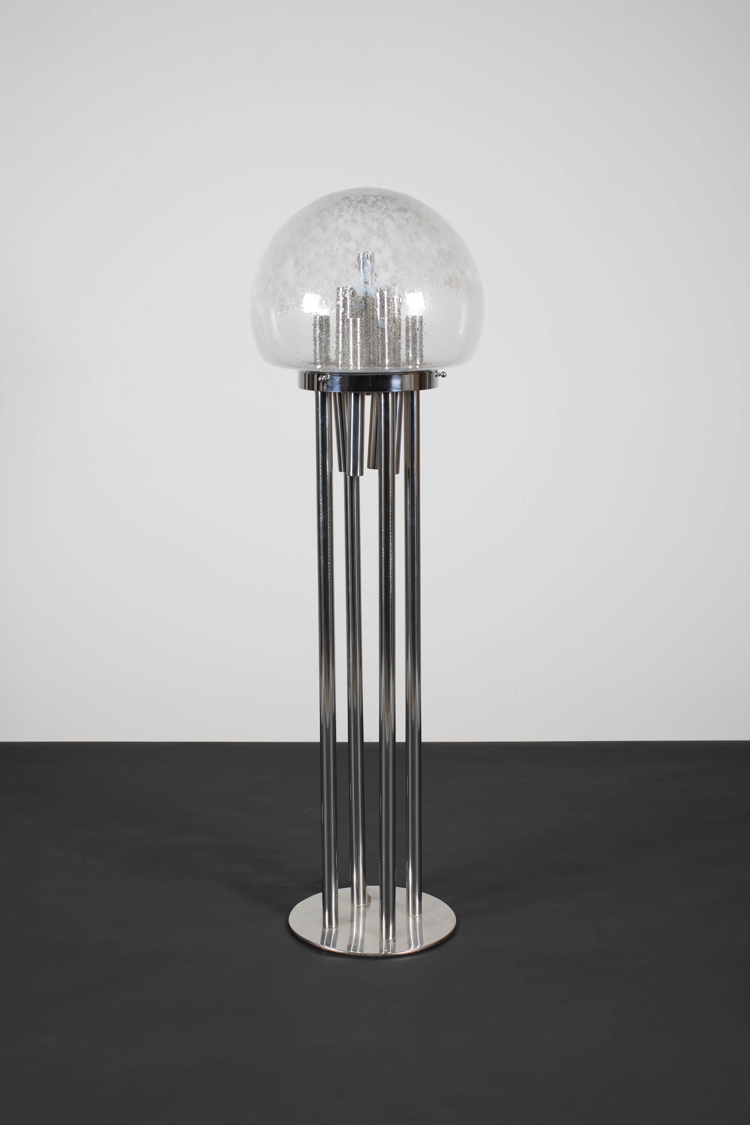 A TUBULAR CHROME FLOOR LAMP