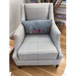 AN UPHOLSTERED EASY CHAIR, BY HELEN TURKINGTON