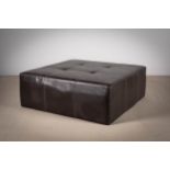 A SQUARE BROWN LEATHER COFFEE TABLE / POUFFE