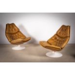 A PAIR OF TANNED LEATHER SWIVEL CHAIRS