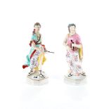 A PAIR OF 18TH CENTURY DERBY PORCELAIN FIGURES decorated in polychrome enamels, one a female