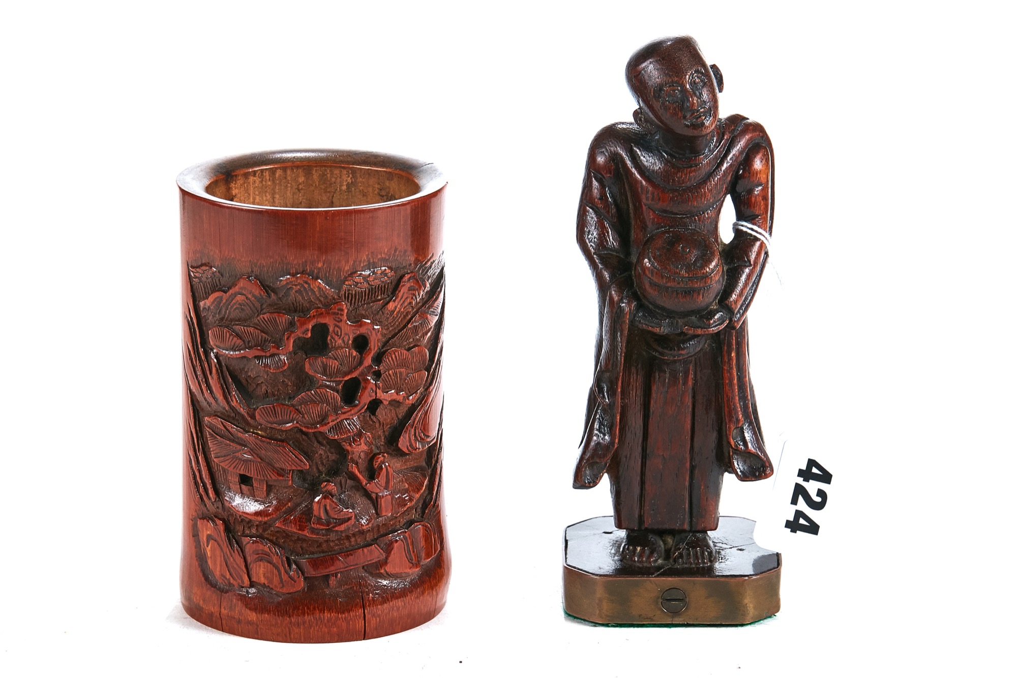 AN 18TH CENTURY CHINESE BAMBOO CARVING OF A BUDDHIST MONK, raised on a canted corner base, 6 1/2 ins