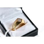 A STYLISH GENTS 18CT GOLD RING set with four square cut diamonds, 0.62 carats, stamped 750, size