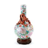 A LATE 19TH CENTURY CHINESE MILLE FLEUR GROUND BOTTLE VASE, the neck decorated with a dragon chasing