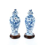A NEAR PAIR OF LATE 19TH CENTURY CHINESE BLUE AND WHITE PORCELAIN BALUSTER VASES AND COVERS