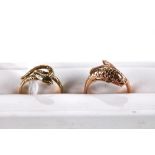 A 9CT YELLOW GOLD COILED SNAKE RING, size Q, stamped 375 and a 9ct yellow gold DOLPHIN RING, size S,