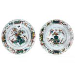 A PAIR OF EARLY 18TH CENTURY CHINESE KANG-HSI PORCELAIN PLATES decorated in famille-verte palette