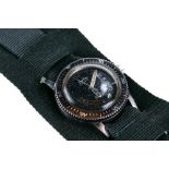 A YOUTHS SIZE STAINLESS STEEL "SANDOZ" AUTOMATIC WRIST WATCH, black dial with date aperture and