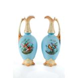 A PAIR OF LATE 19TH CENTURY AUSTRIAN PORCELAIN EWERS, matt blue ground decorated with polychrome