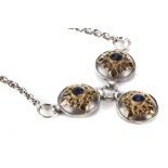A C.W. SELLOR'S DESIGN SILVER AND GOLD NECKLACE, three circular panel design with lapis lazuli and