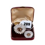 A DANISH SILVER-GILT AND WHITE ENAMEL FLOWER HEAD BROOCH, marked A.M, sterling, Denmark, 1 1/4 ins