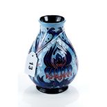 A MOORCROFT POTTERY BALUSTER VASE designed by Phil Hilditch, pale blue ground decorated with