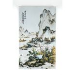 A FINELY PAINTED 20TH CENTURY CHINESE PORCELAIN PLAQUE, polychrome decorated with a mountainous