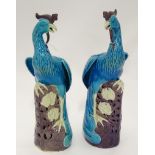 A pair of 21stC Chinese ceramic peacock ornaments CONDITION: Please Note - we do