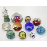 A quantity of glass paperweights etc.