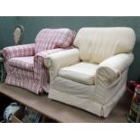 A pair of upholstered armchairs with different covers This lot is being sold for our nominated