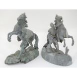 A pair of cast metal figures depicting a man trying to restrain a bucking horse This lot is being