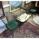 A suite of wrought iron furniture comprising 2 armchairs,