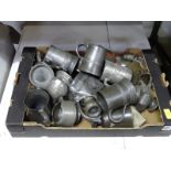 A box of assorted pewter to include pint jars, measures, teapots etc.