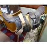 Two mid sized leather English saddles with girth and stand CONDITION: Please Note -