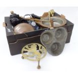 A box of assorted miscellaneous items to include brass trivets,