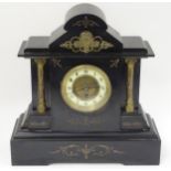 Brass and slate cased mantle clock: A 30hr timepiece with a 4 1/2" dial with porcelain chapter ring,