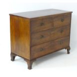 An early 19thC mahogany chest of drawers with a rectangular top above two short over two long