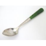 A small silver spoon with nephrite handle. Marked Sterling Silver J S & S. Probably New Zealand.