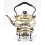 A late 19thC / early 20thC silver plate spirit kettle on stand with burner under the whole 12" high